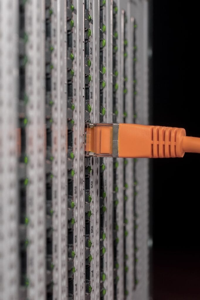 gbff03860788b22baba52a3775c12ddfe4c29041332863fa3895628a8ec53eab1399118e525c4765860c758a465e418e5_1280-838378 Orange network cable plugged in to board with green LEDs