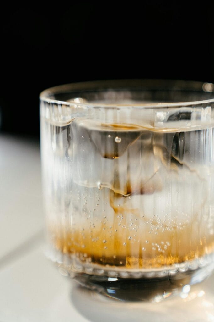 pexels-photo-4667180-4667180 Close-up of a glass of whisky and iceass offering a refreshing visual.