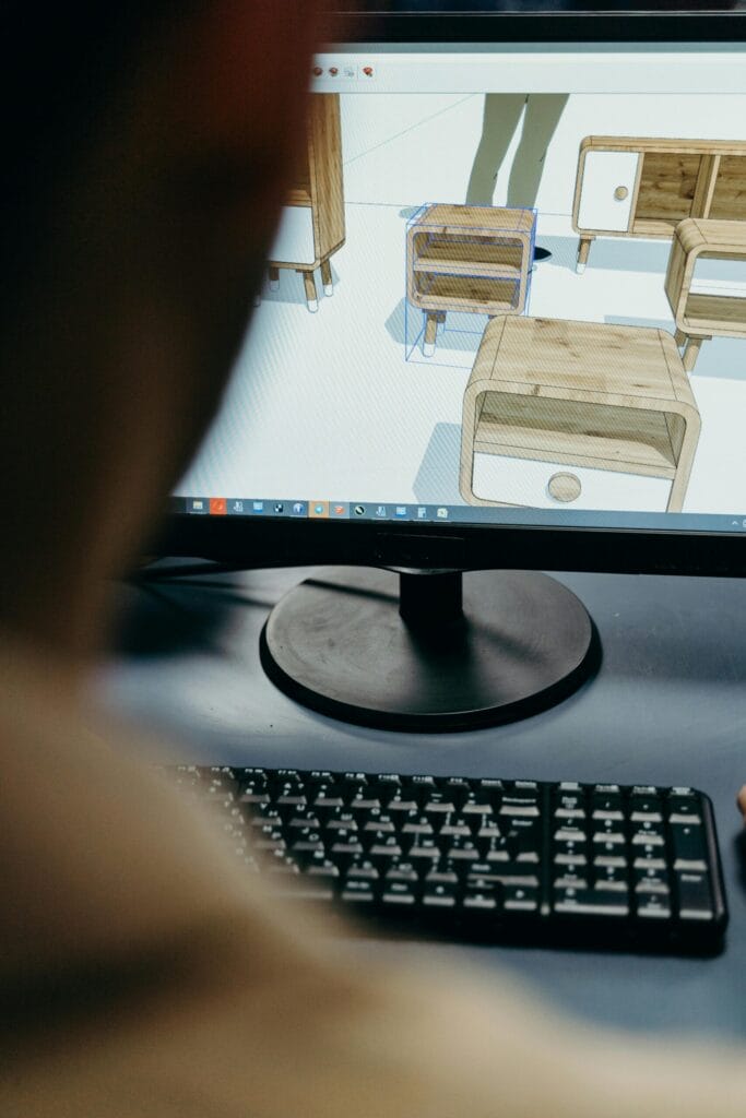 Close-up of computer monitor showing CAD system design of furniture.