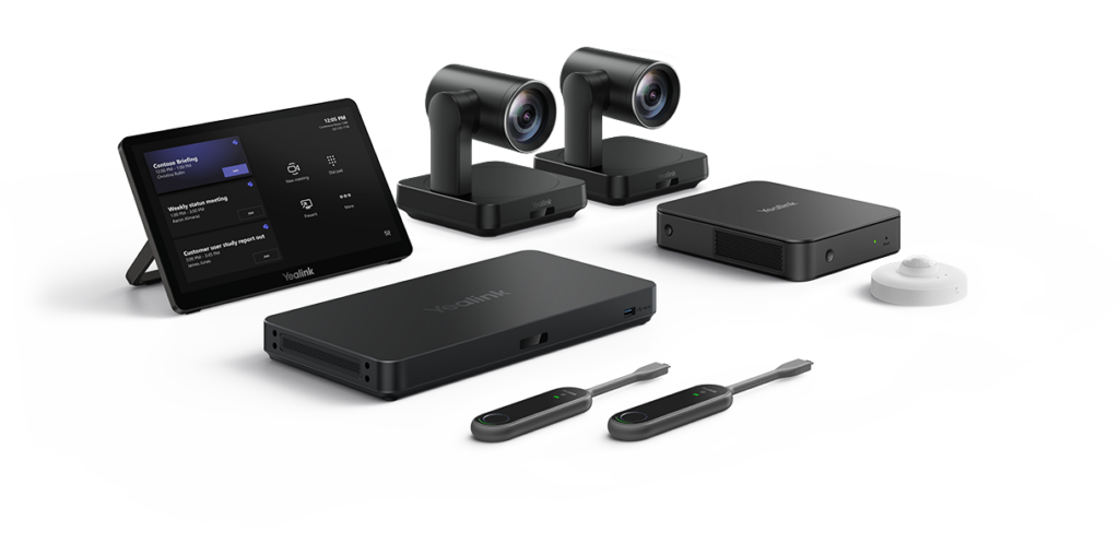 A professional Yealink Teams Room console and camera system set up in a modern conference room, featuring a sleek touch controller for one-touch meeting starts.